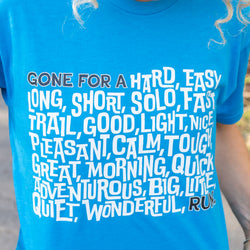 A bright blue short-sleeve t-shirt featuring a white typographic graphic that reads 'GONE FOR ___ RUN.'.