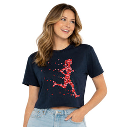 Woman wearing a navy blue t-shirt with a red heart running woman design on a white background
