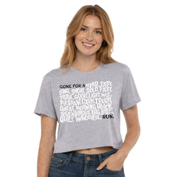 Woman wearing a gray t-shirt with gone for a run text design on a white background