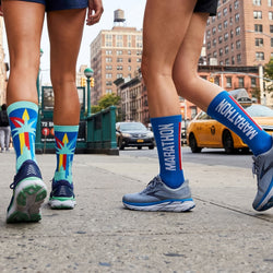 Runners wearing socks with nyc style marathon designs