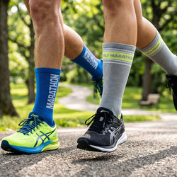 Two pairs of running shoes and socks with 'Marathon' and 'Half Marathon' text on a road.