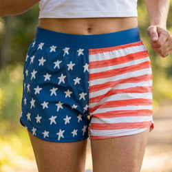 Person wearing shorts with American flag design outdoors