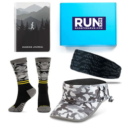 Collection of running gear including socks, a cap, a headband, and a running journal with 'RUNBOX' branding.