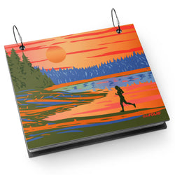 Bibfolio bib album with a design of a person running by a lake at sunset, on a white background.