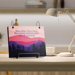 Bibfolio with motivational quote on a desk with a lamp and cup in the background