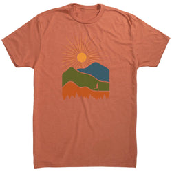 Orange t-shirt with a graphic of mountains and a sun on a white background