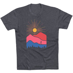 Gray t-shirt with a colorful mountain and sun design on a white background