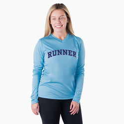 Woman wearing a blue long-sleeve shirt with 'RUNNER' text on a white background