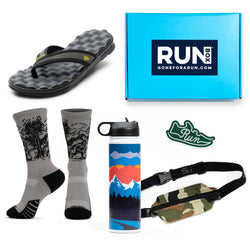 Collection of running gear including sandals, socks, a water bottle, and a fanny pack with a 'RUN BOX' branded box.