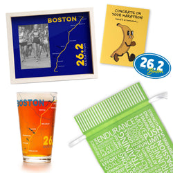 Collection of marathon items that are Boston-themed items including a frame, glass, sticker, and card. Includes green gift bag.