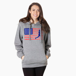 Woman wearing a gray hoodie with an American flag and running person design on a white background