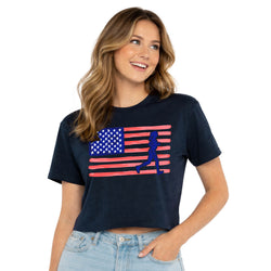 Woman wearing a navy blue t-shirt with an American flag and running silhouette design on a white background
