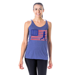 Woman wearing a blue tank top with an American flag and running silhouette design on a white background