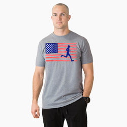 Man wearing a gray t-shirt with an American flag and running figure design on a white background