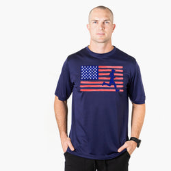 Man wearing a navy blue t-shirt with an American flag graphic on a white background