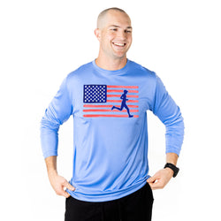 Man wearing a blue long-sleeve shirt with an American flag and running person design on a white background