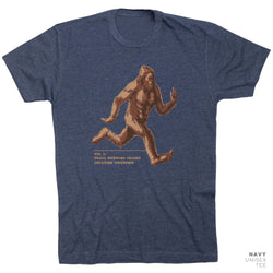 Navy t-shirt with a brown running Bigfoot graphic on a white background