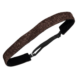 Brown glittery headband with black strap on a white background