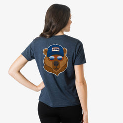 Person wearing a blue t-shirt with a bear graphic on the back