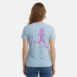 Light blue t-shirt with colorful graphic on the back worn by a person, on a white background