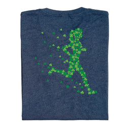 Folded blue t-shirt with green shamrock runner design on a white background