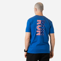 Man wearing a blue t-shirt with a red, white, and blue RUN design on the back against a white background