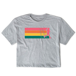 A heather gray short-sleeve t-shirt with a graphic on the chest featuring horizontal stripes in pink, orange, yellow, and green, overlaid with a pink silhouette of a running person.