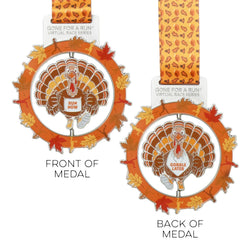 Two race medals from Gone For A Run featuring a Thanksgiving turkey design with autumn leaves and orange ribbon straps on a white background.
