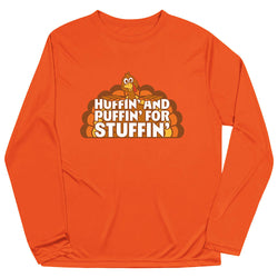 An orange long-sleeve crewneck shirt featuring a cartoon turkey graphic and the text 'HUFFIN' AND PUFFIN' FOR STUFFIN'' printed on the chest, displayed against a solid white background.