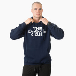 A man wearing a navy blue hoodie with 'THE Daily Run CLUB' printed in white across the chest, posing with the hood up against a light gray background.