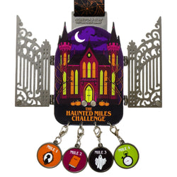The Haunted Miles Challenge medal with a gate and image of a haunted mansion. Below medal are four dangling round mile markers, shown on a plain white background.