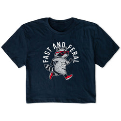 A navy blue short-sleeve t-shirt with a graphic of a raccoon wearing red sunglasses and a 'BIB' shirt, running under the text 'FAST AND FERAL'.