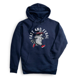 A navy blue pullover hoodie with a front kangaroo pocket and a graphic of a raccoon wearing red sunglasses and red shoes, with the text 'FAST AND FERAL' arched above it.