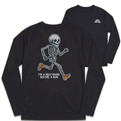 Black long-sleeve t-shirt shown from the back, featuring a white running skeleton graphic with orange shoes and the text 'I'M A NIGHTMARE BEFORE A RUN'. A second view in the background shows the front with a small white chest logo.