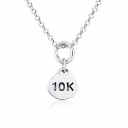 A sterling silver necklace with a round disc pendant engraved with '10K' in black lettering, shown against a plain white background.