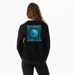 A woman viewed from the back wearing a black sweatshirt with a large blue graphic on the back featuring the text 'NO DAYSOFF' and a volleyball design, paired with black leggings against a plain white background.