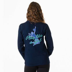 A woman viewed from the back wearing a navy blue long-sleeve shirt with a light blue graphic of a volleyball player and the text 'Play like a Girl' on the back, set against a plain white background.