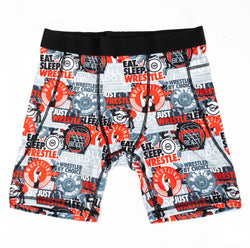 Flat lay of wrestling themed compression shorts with various designs