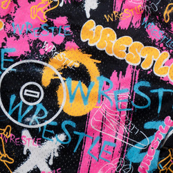 Close-up of a black fabric with a colorful graffiti-style wrestling graphic print featuring the word 'WRESTLE' in multiple colors including pink, yellow, blue, and white.