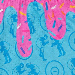 A close-up of a bright blue mesh fabric with a pink dripping frosting design, blue wrestlers silhouettes, and colorful sprinkle details.